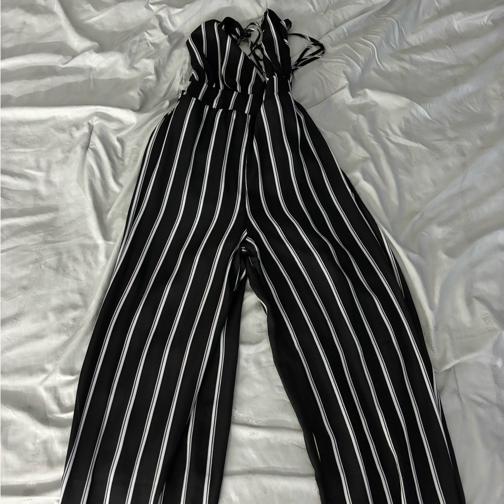 Black and cream striped v neck jumpsuit. Size S.